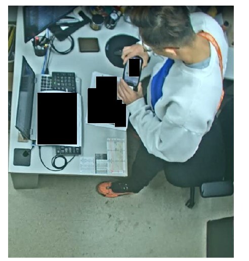 Alleged footage of Jian Zhao taking photos of classified information. 