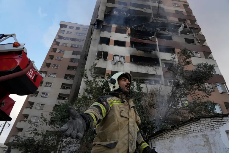 Firefighter in northern Tehran at the scene of an explosion in a residential compound